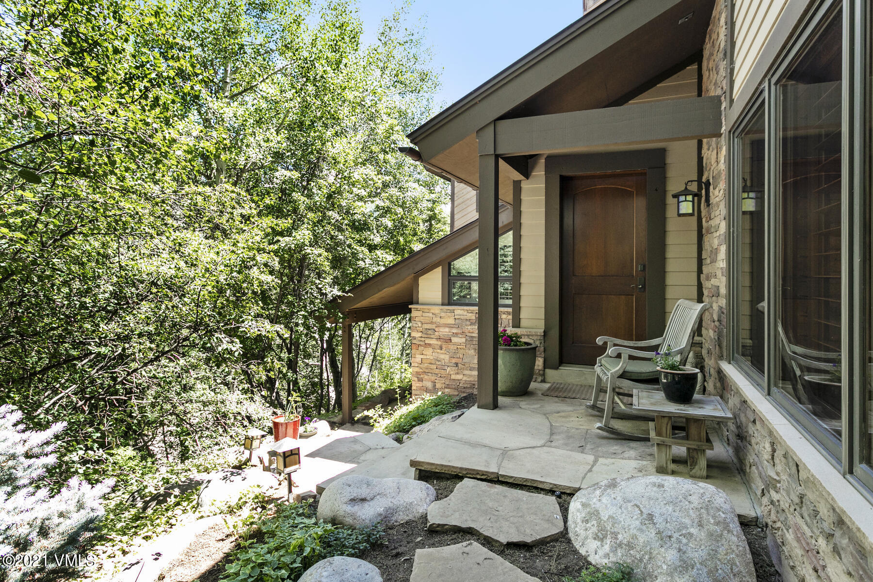850 Eagle Drive Eagle-Vail, CO 81620 - Photo 1 of 44 a backyard of a house with outdoor seating