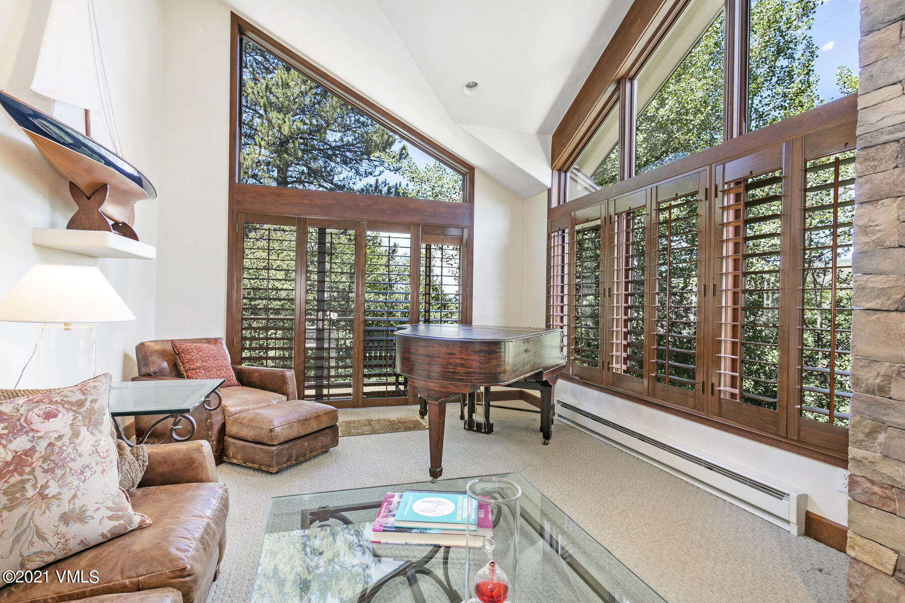 850 Eagle Drive Eagle-Vail, CO 81620 - Photo 16 of 44 a living room with furniture and a floor to ceiling window