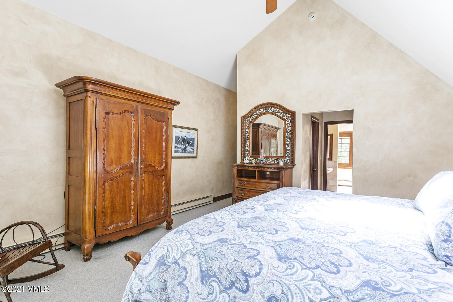 850 Eagle Drive Eagle-Vail, CO 81620 - Photo 19 of 44 a bedroom with a bed and a dresser
