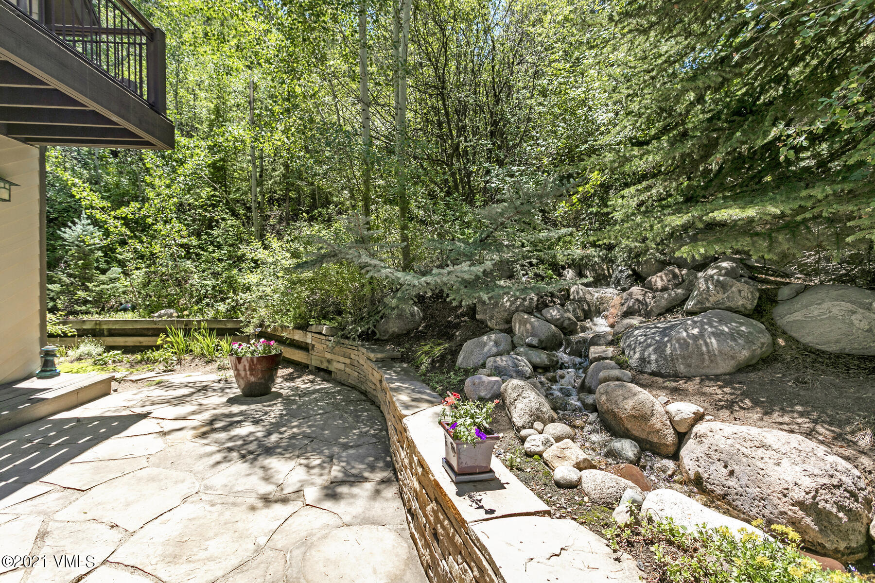 850 Eagle Drive Eagle-Vail, CO 81620 - Photo 2 of 44 a backyard of a house with lots of green space