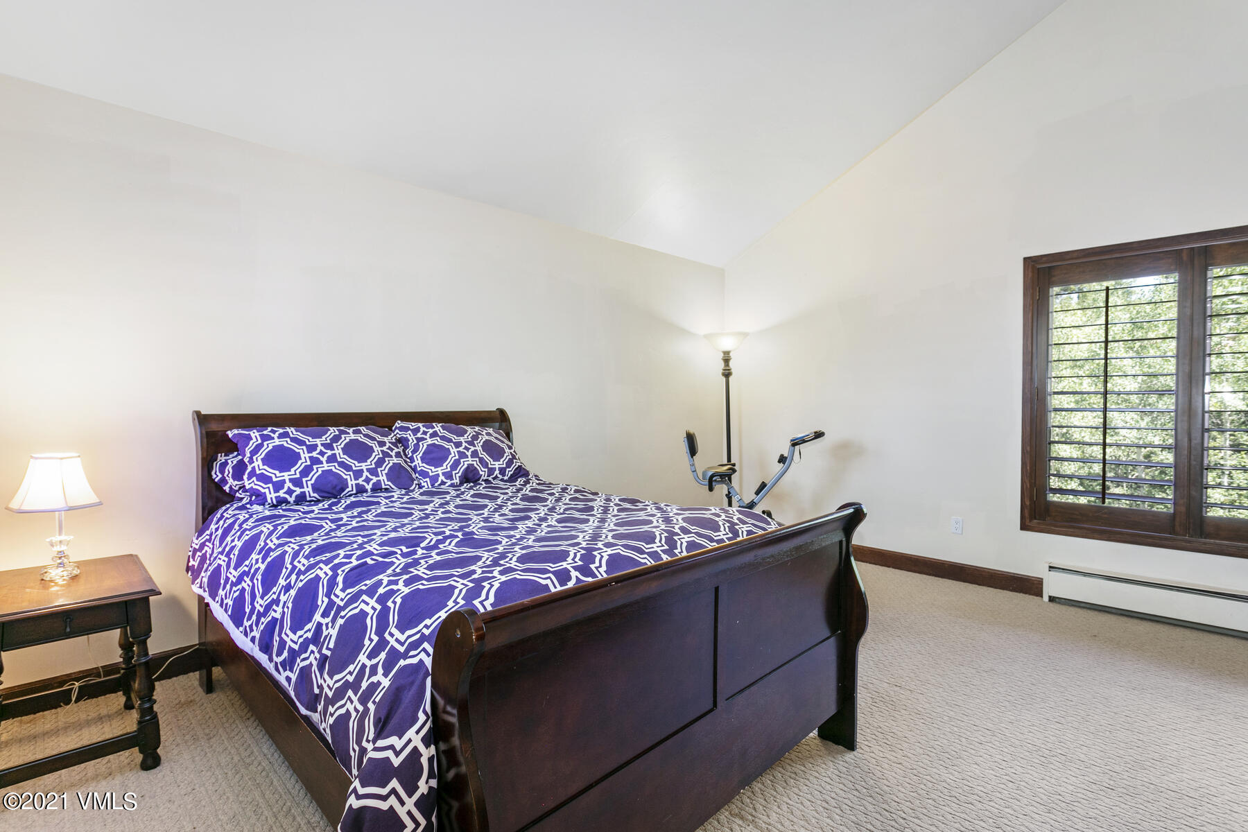 850 Eagle Drive Eagle-Vail, CO 81620 - Photo 25 of 44 a bed sitting in a bedroom next to a window