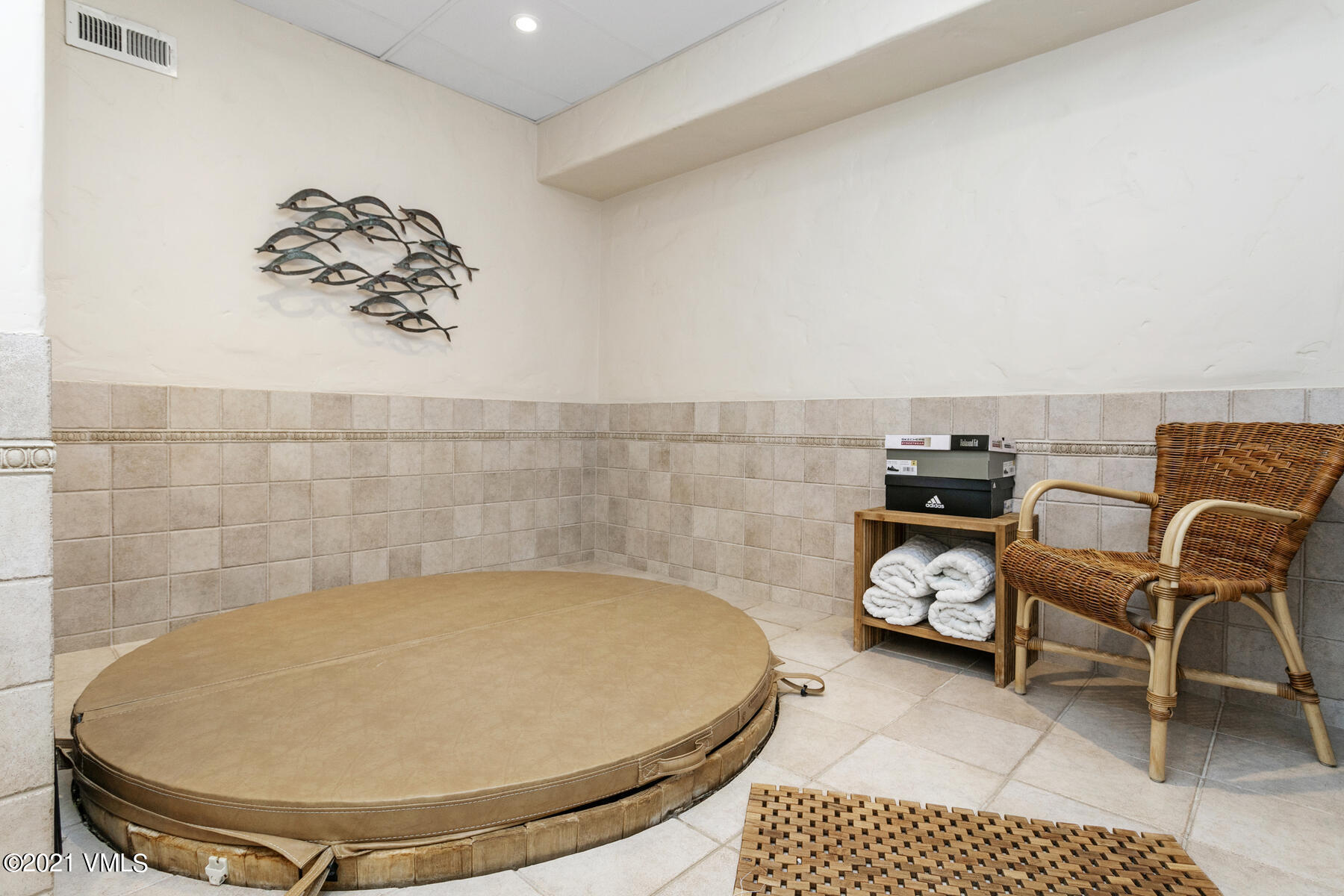 850 Eagle Drive Eagle-Vail, CO 81620 - Photo 28 of 44 a picture of a living room with a rug and a chair