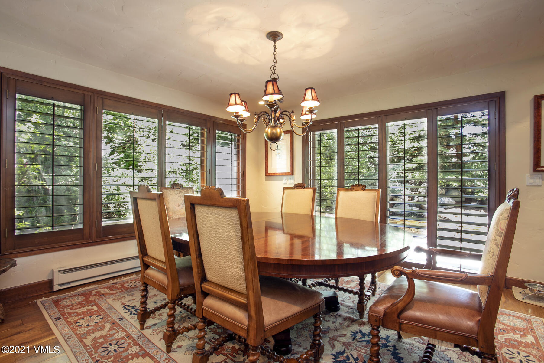 850 Eagle Drive Eagle-Vail, CO 81620 - Photo 9 of 44 a view of a dining room with furniture wooden floor and chandelier