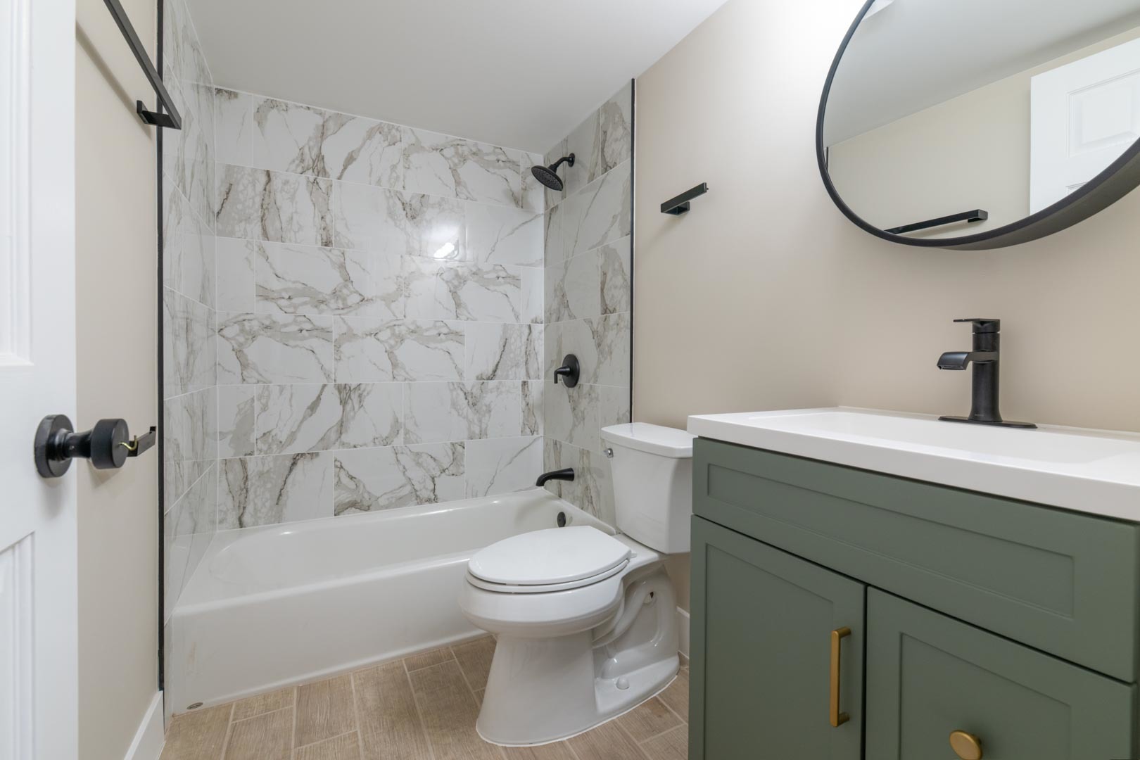 1303 West Flournoy Street, Unit 2F Chicago, IL 60607 - Photo 11 of 16 a bathroom with a sink a toilet and a mirror