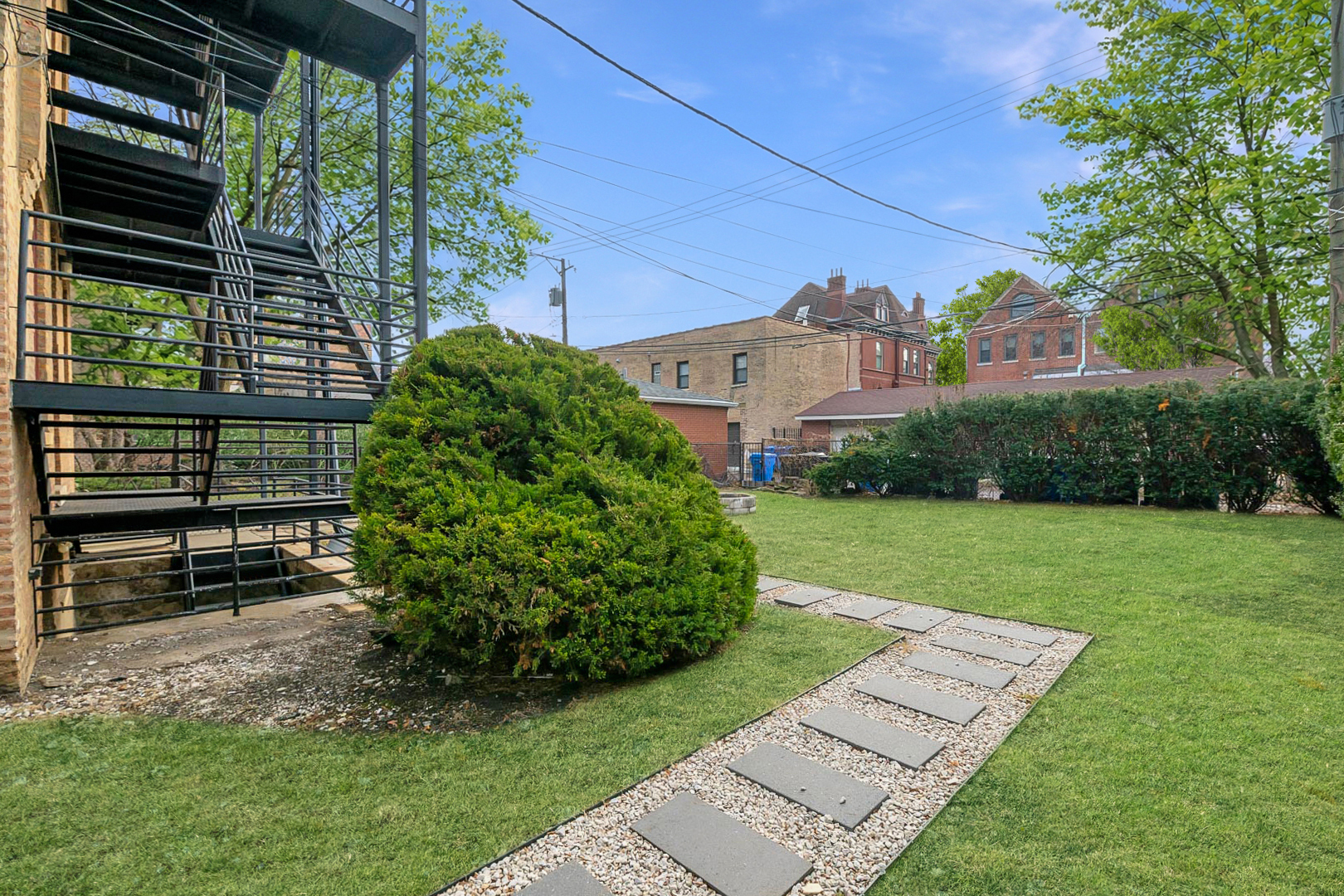 1303 West Flournoy Street, Unit 2F Chicago, IL 60607 - Photo 15 of 16 a view of a house with a yard