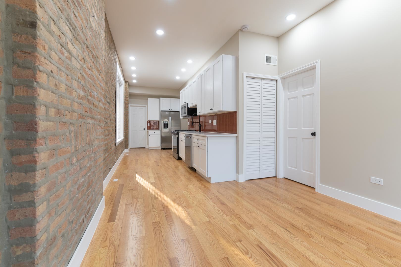 1303 West Flournoy Street, Unit 2F Chicago, IL 60607 - Photo 4 of 16 a view of kitchen with sink and refrigerator