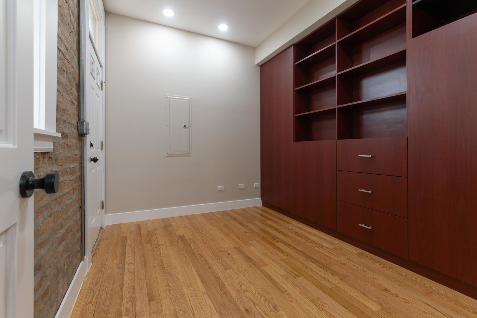 1303 West Flournoy Street, Unit 2F Chicago, IL 60607 - Photo 10 of 16 wooden floor in an empty room