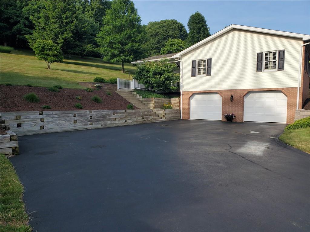 1760 Parkwood Road Indiana, PA 15701 - Photo 5 of 25 a view of a white house with a yard