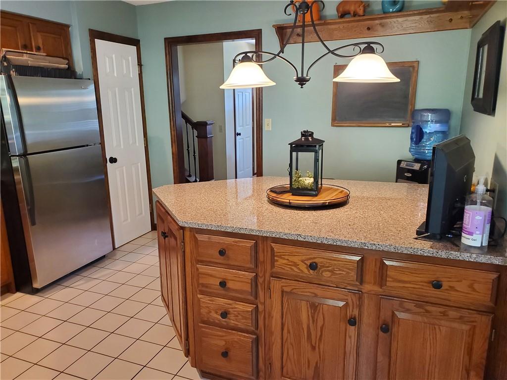 1760 Parkwood Road Indiana, PA 15701 - Photo 9 of 25 a kitchen with cabinets and stainless steel appliances