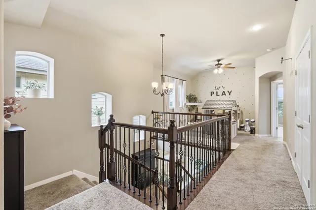 a view of a hallway with windows