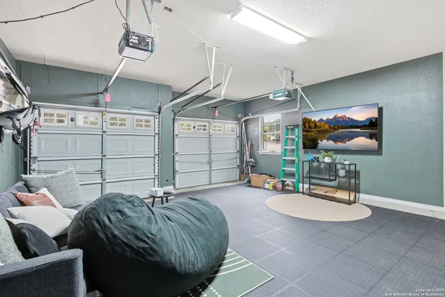 a bed room with furniture and a chandelier