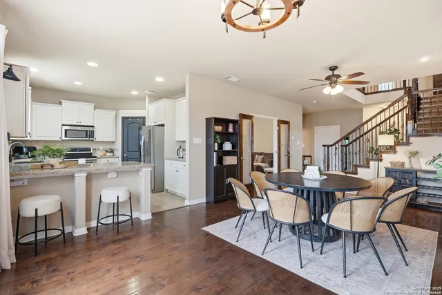 a view of a dining room with furniture and wooden floor