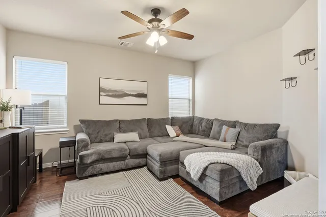 a living room with furniture and a large window