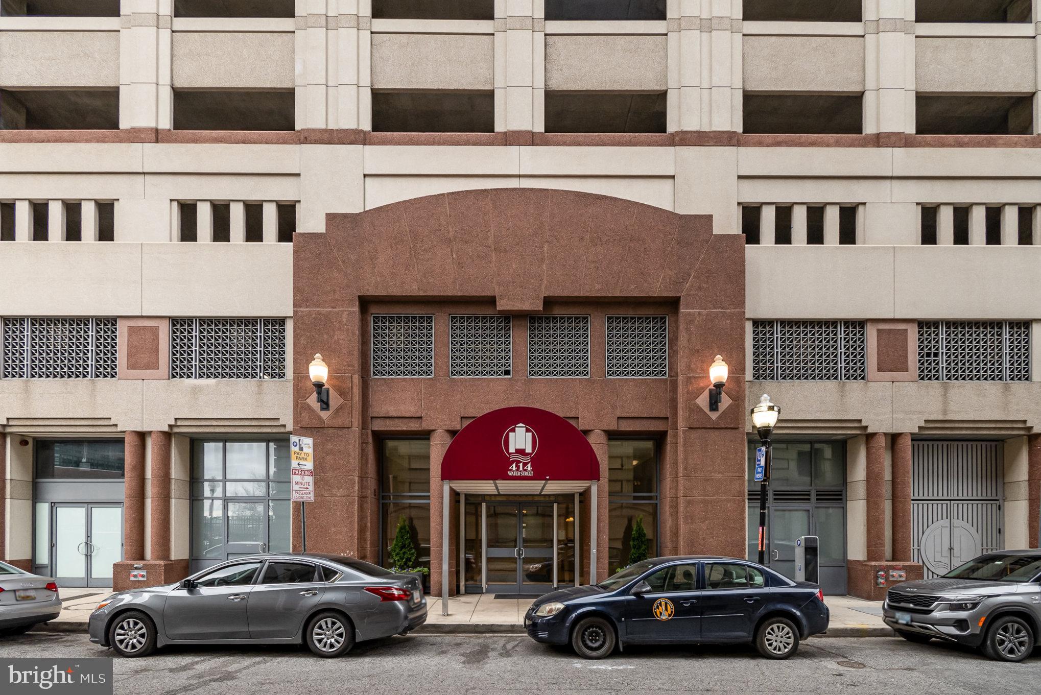 414 Water Street, Unit 1512 Baltimore, MD 21202 - Photo 3 of 28 a car parked in front of a building