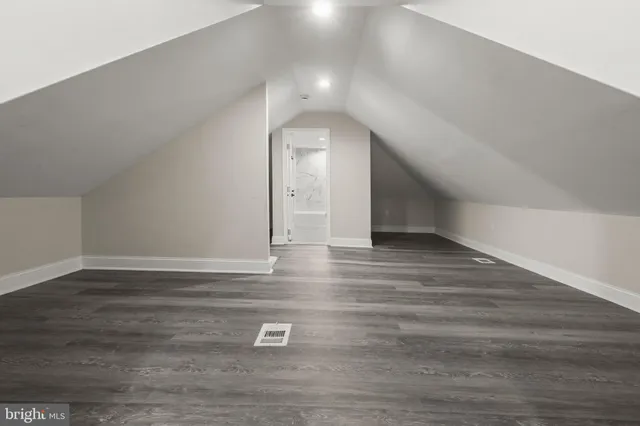 a view of a livingroom with wooden floor