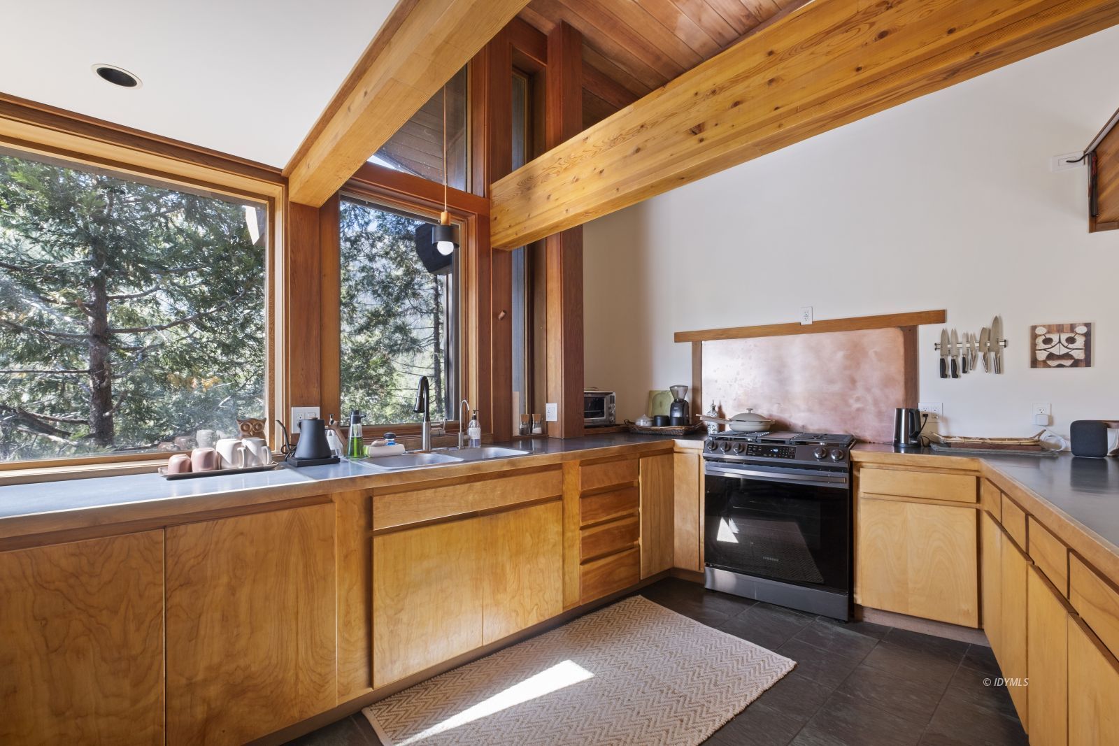 55526 Howland Road Idyllwild, CA 92549 - Photo 12 of 22 a open kitchen with stainless steel appliances granite countertop a sink stove and refrigerator