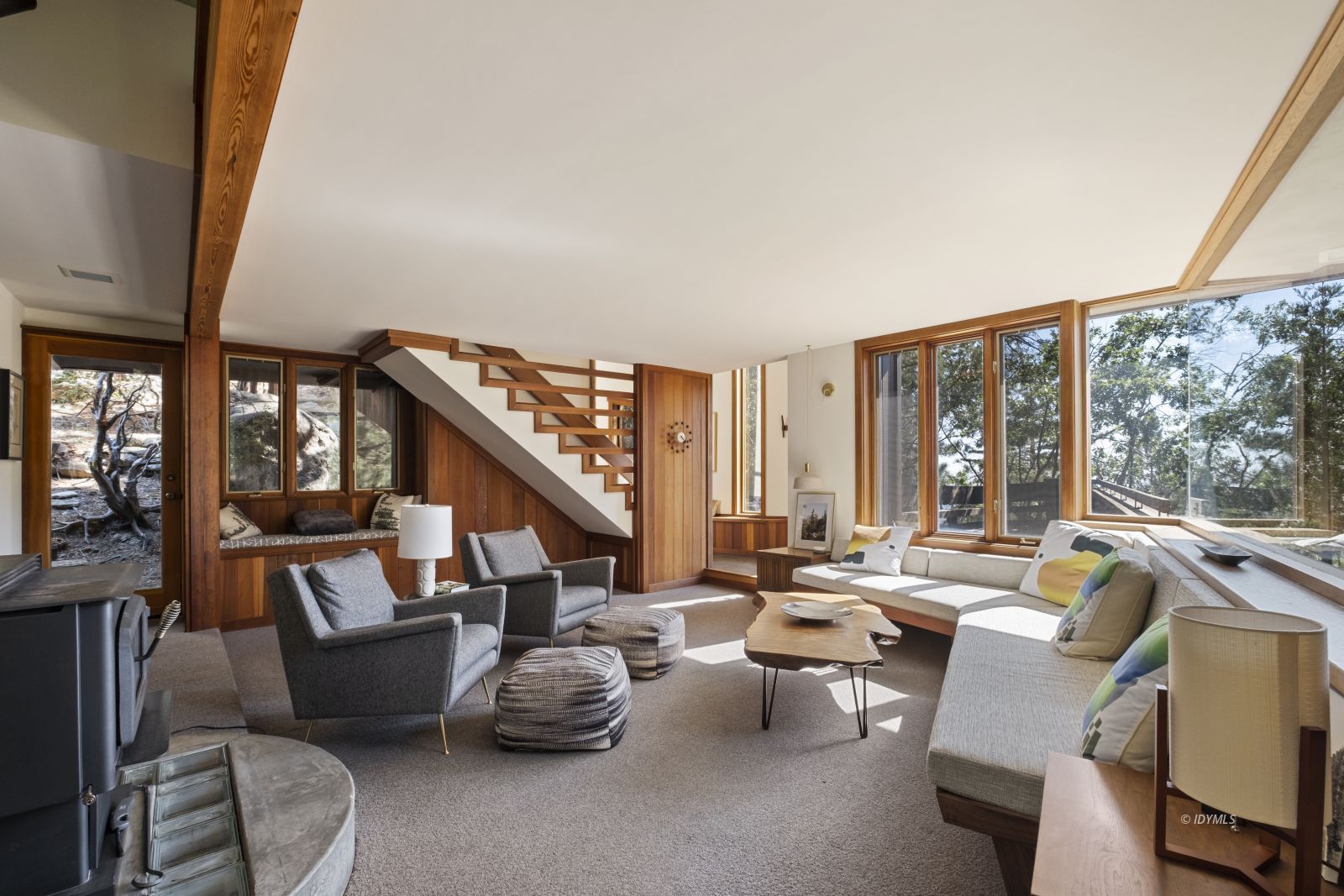 55526 Howland Road Idyllwild, CA 92549 - Photo 5 of 22 a living room with furniture and floor to ceiling windows