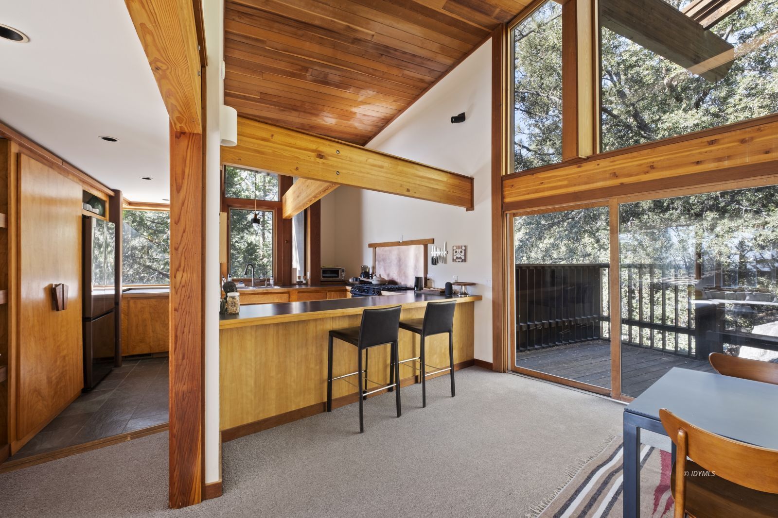55526 Howland Road Idyllwild, CA 92549 - Photo 10 of 22 a view of a patio with a table chairs and backyard