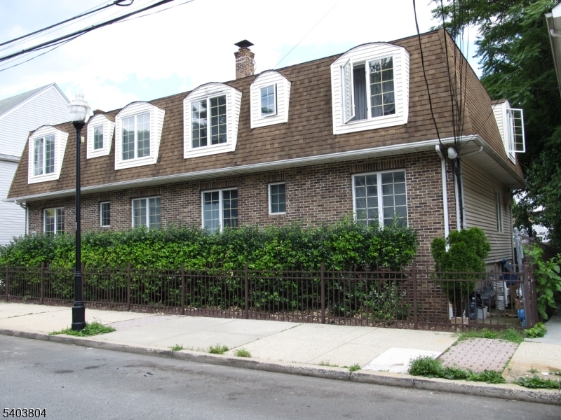 119 Valley Road Clifton, NJ 07013 - Photo 1 of 3 a house that has a lot of windows on it