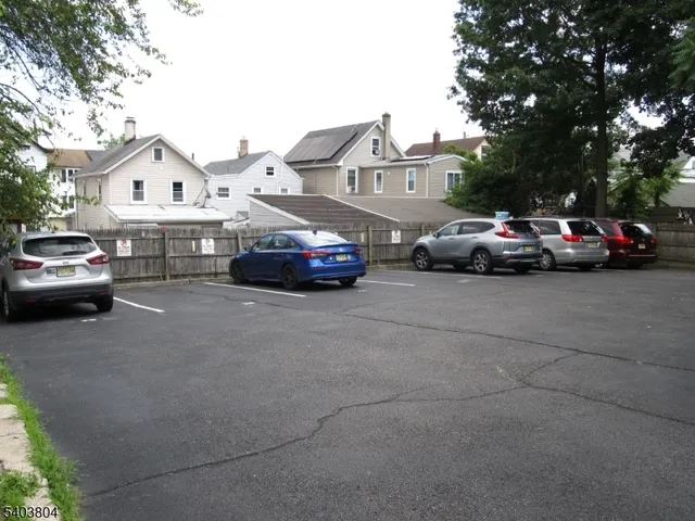 a view of a car parked in front of a house