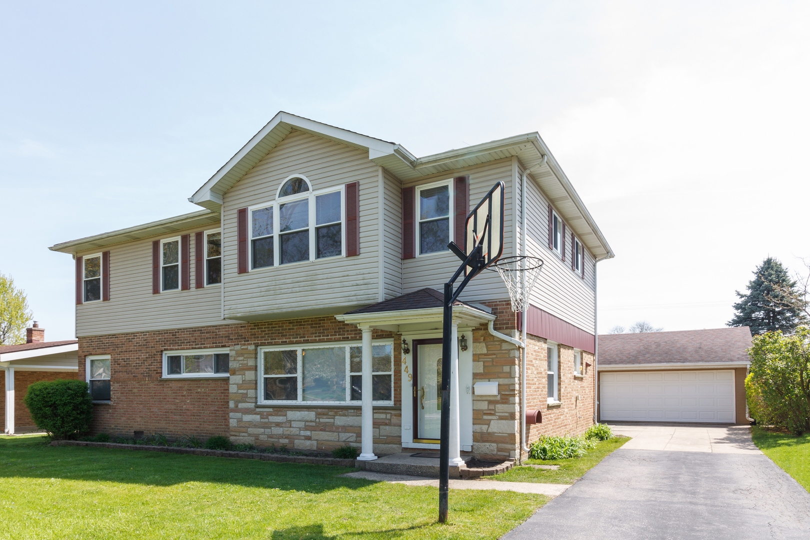449 East Baldwin Road Palatine, IL 60074 - Photo 1 of 2 a front view of a house with garden
