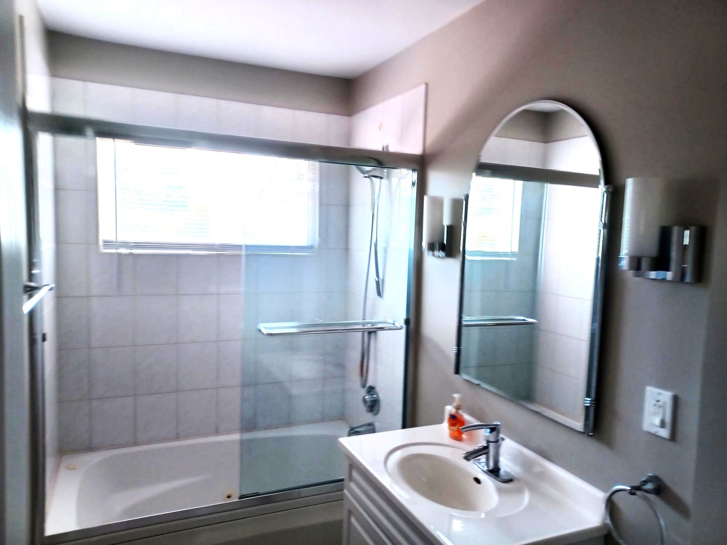 449 East Baldwin Road Palatine, IL 60074 - Photo 2 of 2 a bathroom with a sink and a mirror