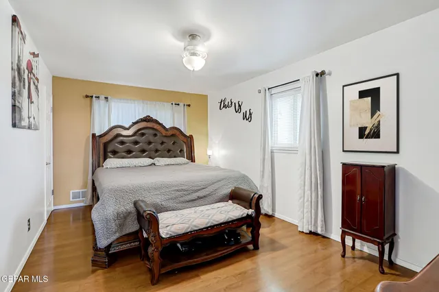 a bedroom with a bed and a chair