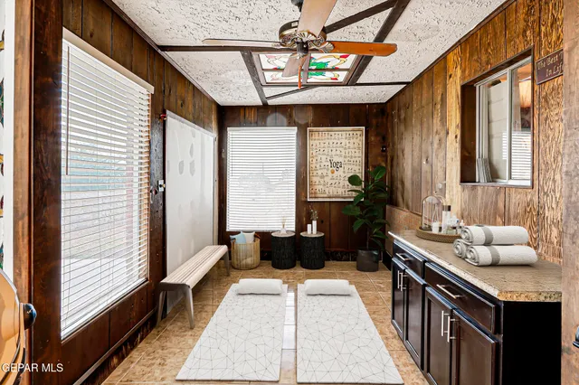 a hallway with a couch and a table
