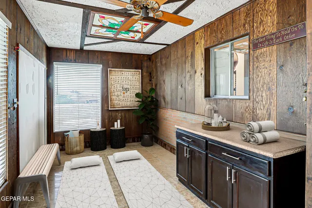 a bathroom with a sink a vanity and a mirror