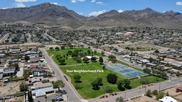 an aerial view of residential houses and outdoor space