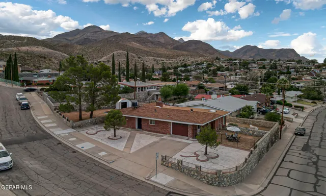 a view of a terrace with a garden and mountain view