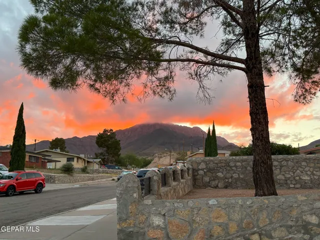 a view of a house with sitting area and garden