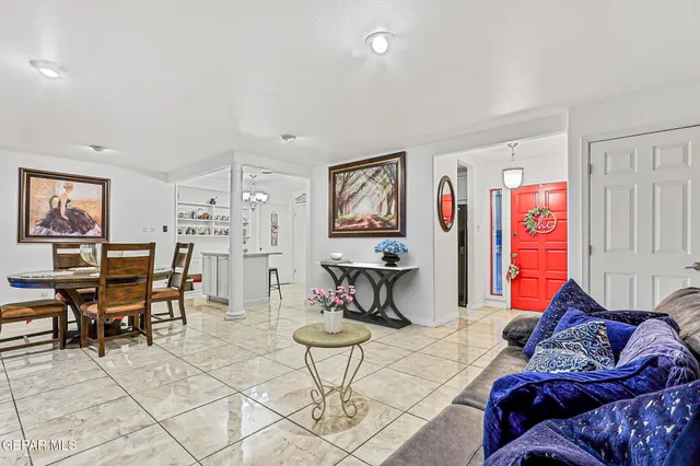 a living room with furniture and cabinets
