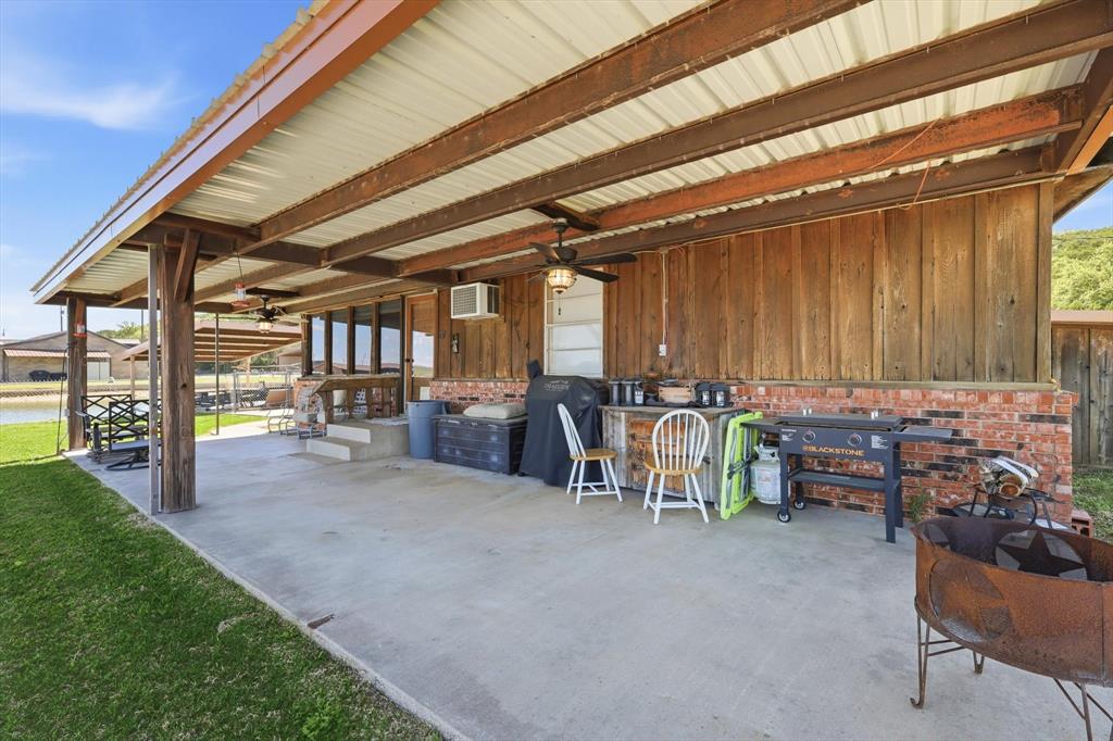 4513 Chapel Road Graham, TX 76450 - Photo 27 of 38 a view of a garage with chairs