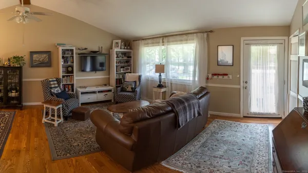 a living room with furniture and a window