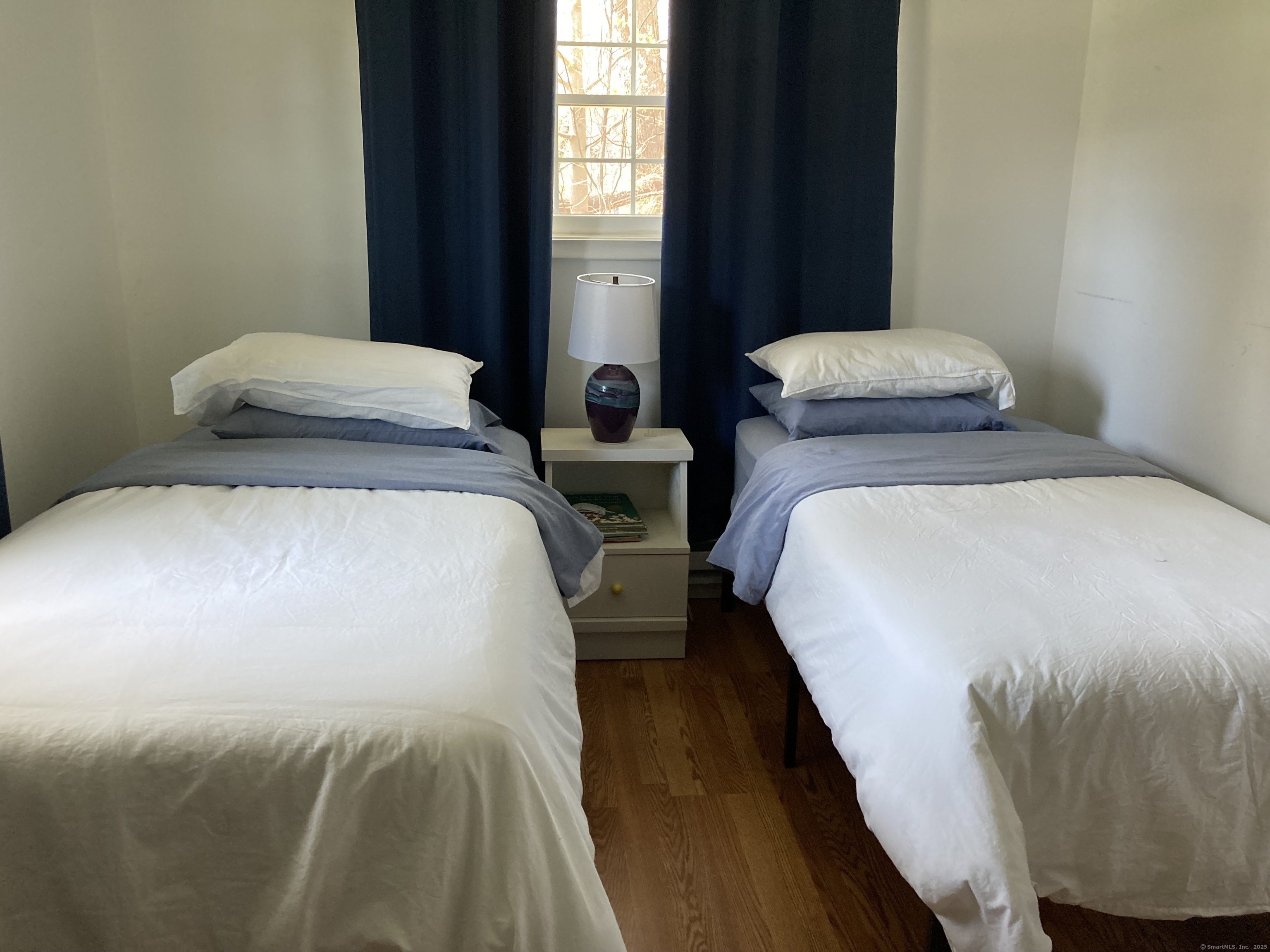 12 Allendale Road Old Saybrook, CT 06475 - Photo 15 of 36 a bedroom with double bed and a window