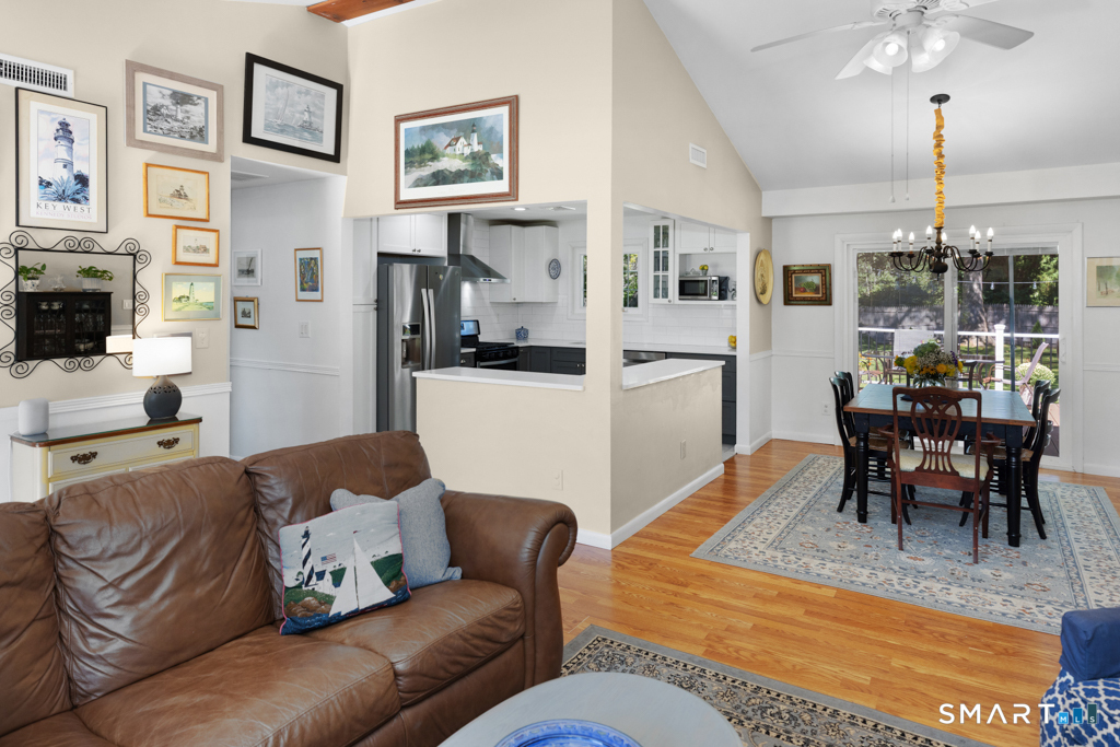 12 Allendale Road Old Saybrook, CT 06475 - Photo 22 of 36 a living room with furniture kitchen view and a dining table