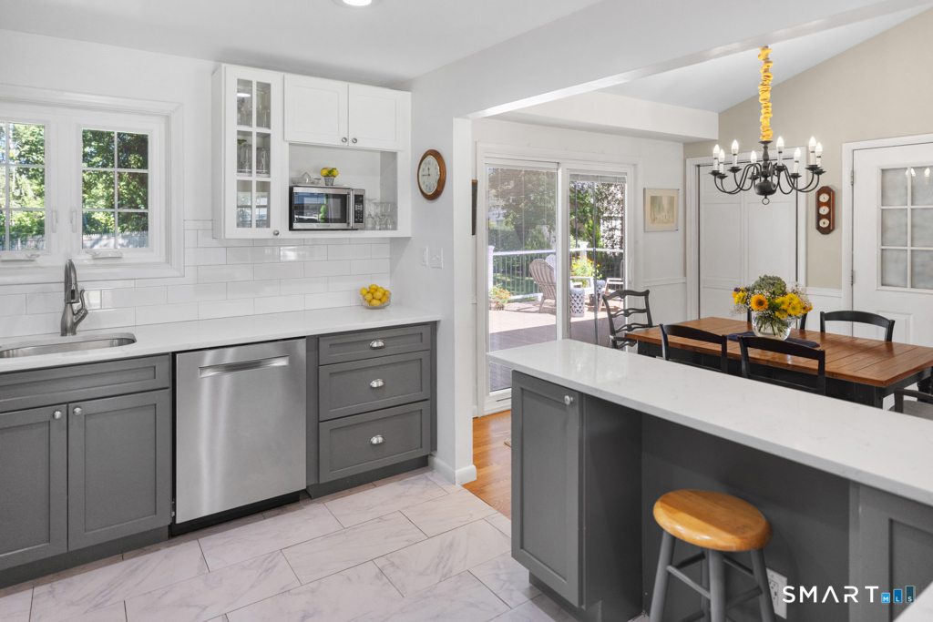 12 Allendale Road Old Saybrook, CT 06475 - Photo 24 of 36 a kitchen with stainless steel appliances a sink and cabinets