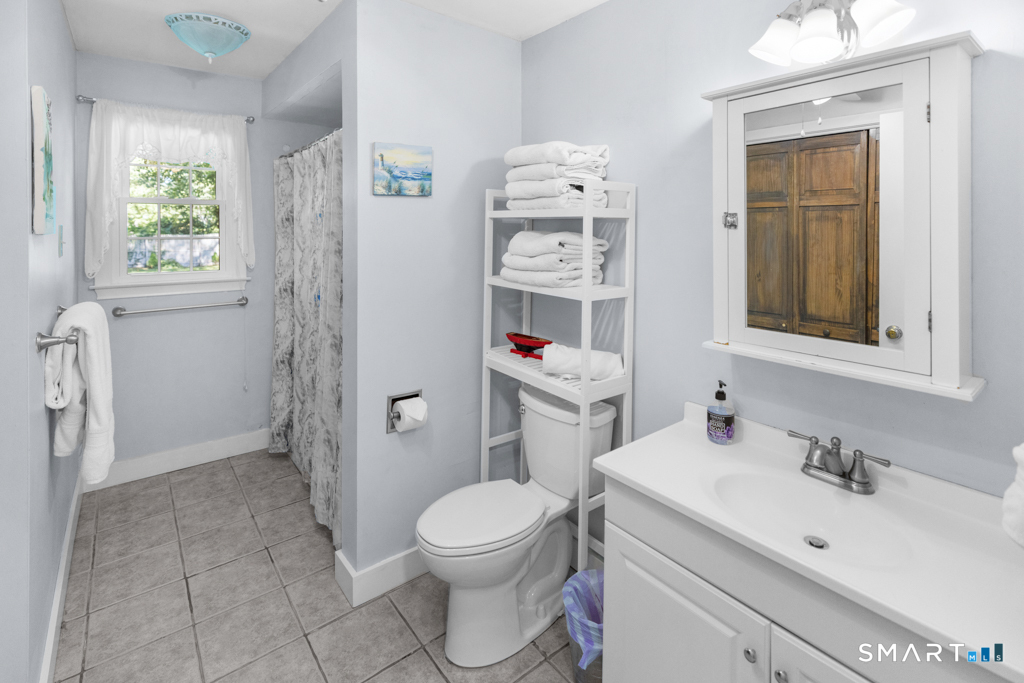 12 Allendale Road Old Saybrook, CT 06475 - Photo 29 of 36 a bathroom with a sink toilet and shower