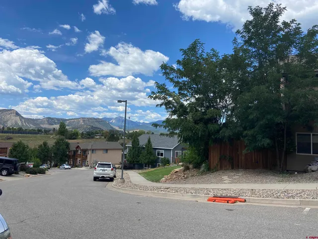 a view of a road with a yard