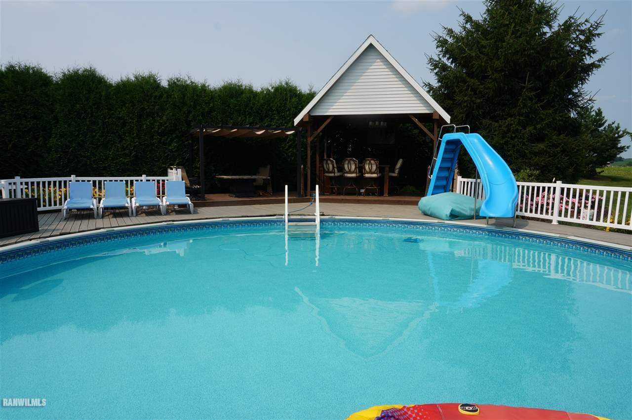 2560 East Maize Road Freeport, IL 61032 - Photo 21 of 25 a view of a backyard with swimming pool