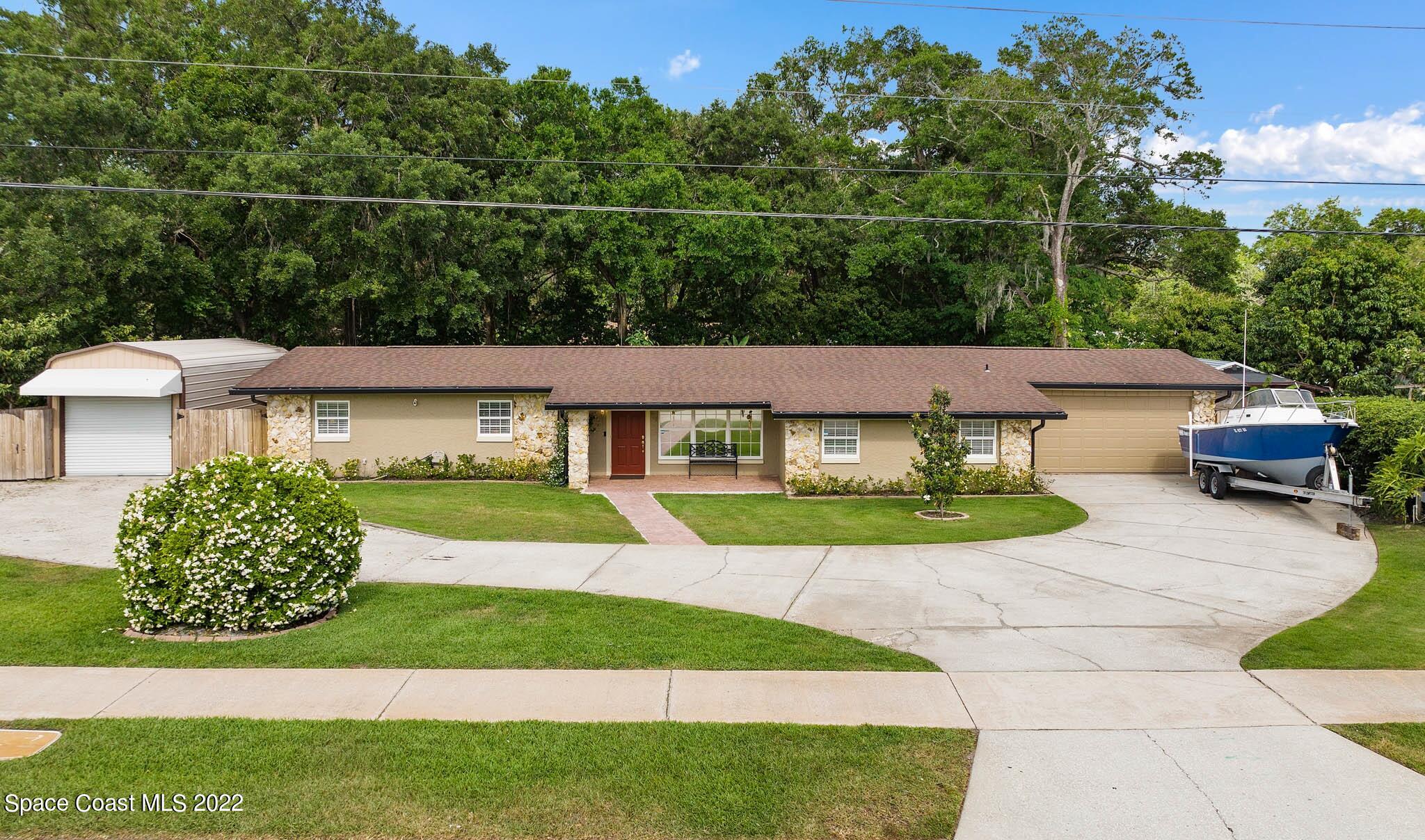 911 Bear Lake Road Apopka, FL 32703 - Photo 1 of 33 a view of a house with a patio