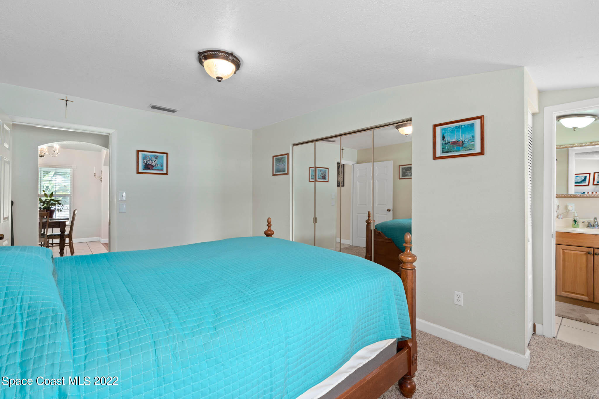 911 Bear Lake Road Apopka, FL 32703 - Photo 22 of 33 a bedroom with a bed and a lamp