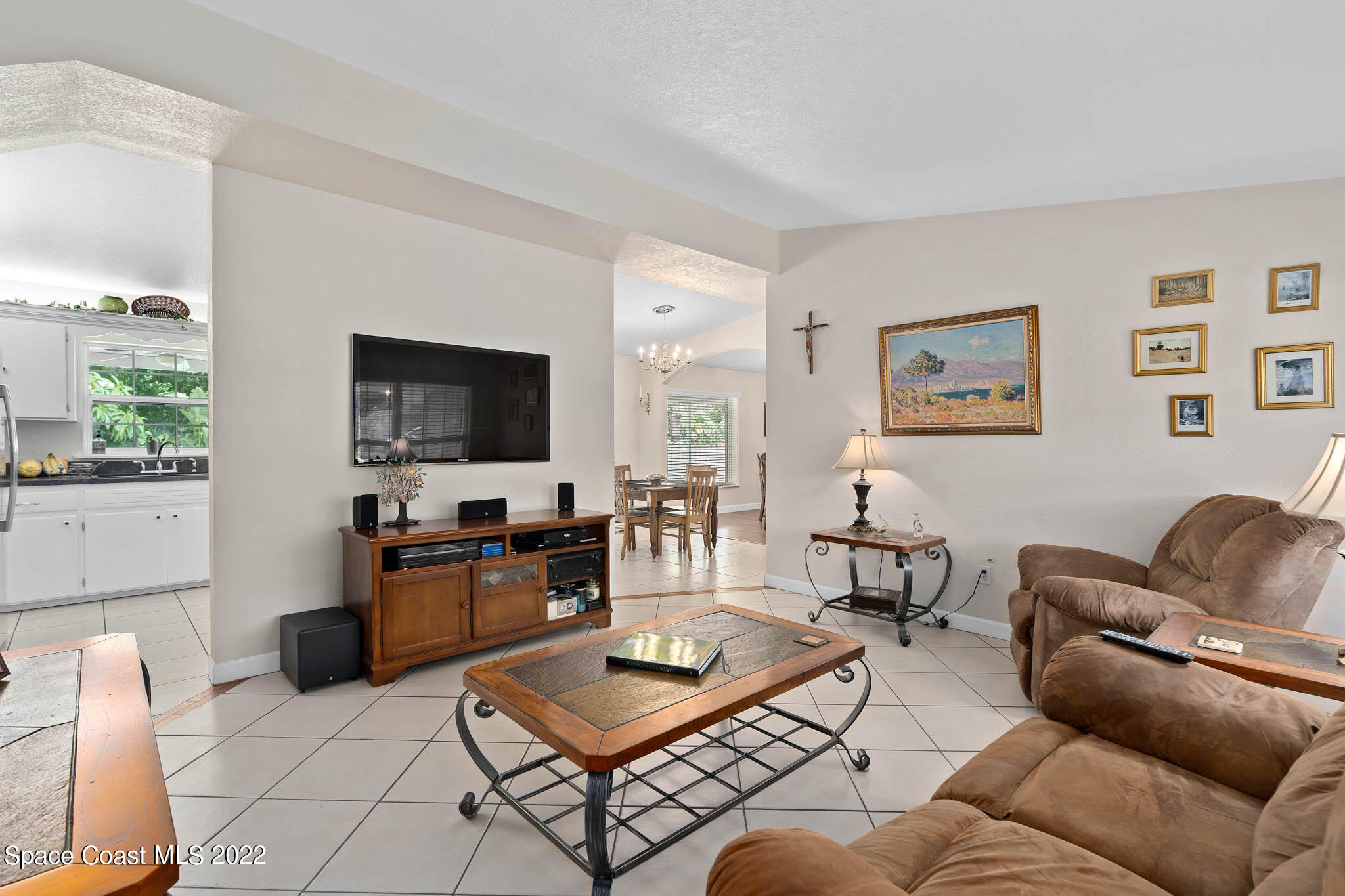 911 Bear Lake Road Apopka, FL 32703 - Photo 6 of 33 a living room with furniture and a flat screen tv