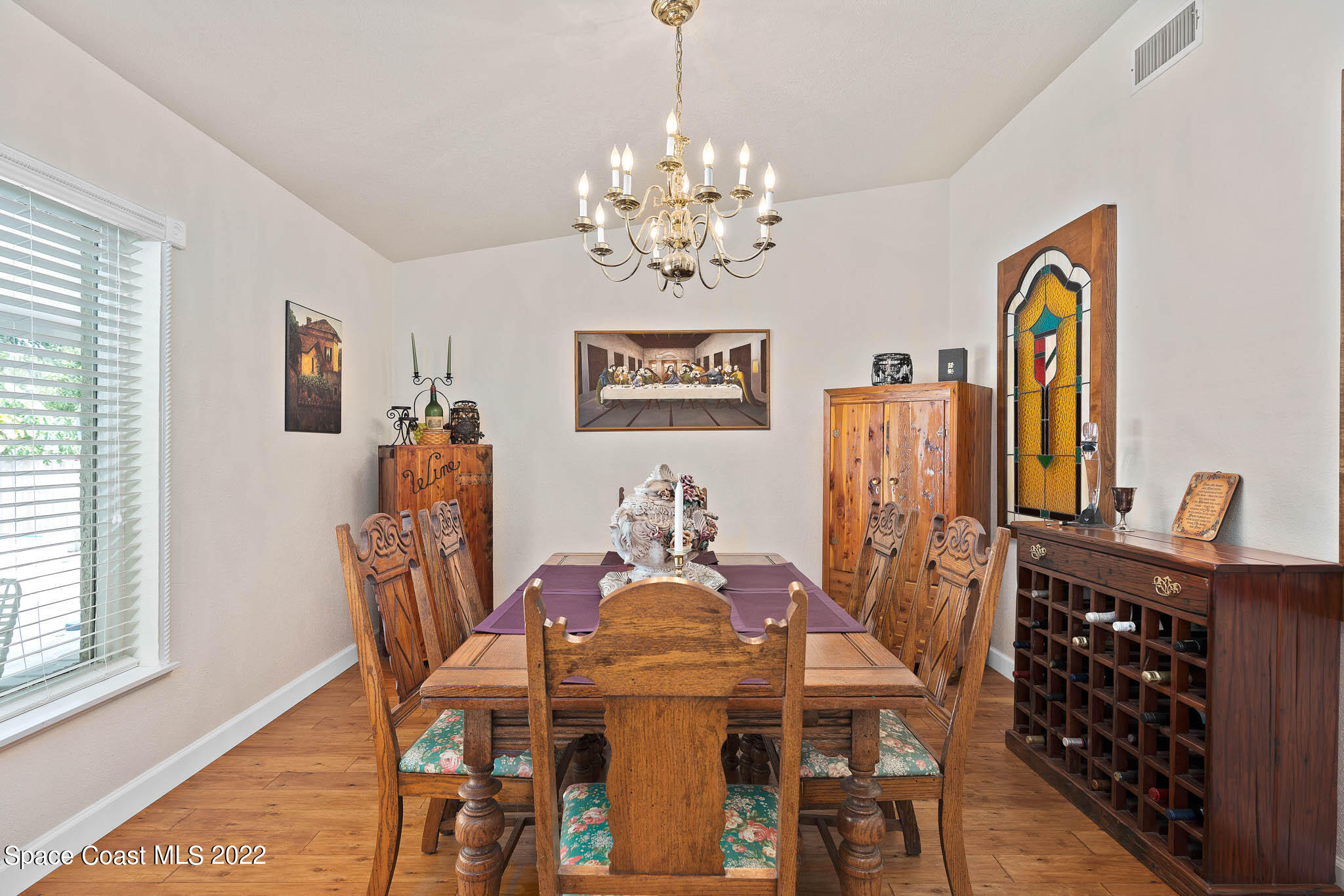 911 Bear Lake Road Apopka, FL 32703 - Photo 10 of 33 a view of a dining room with furniture and chandelier