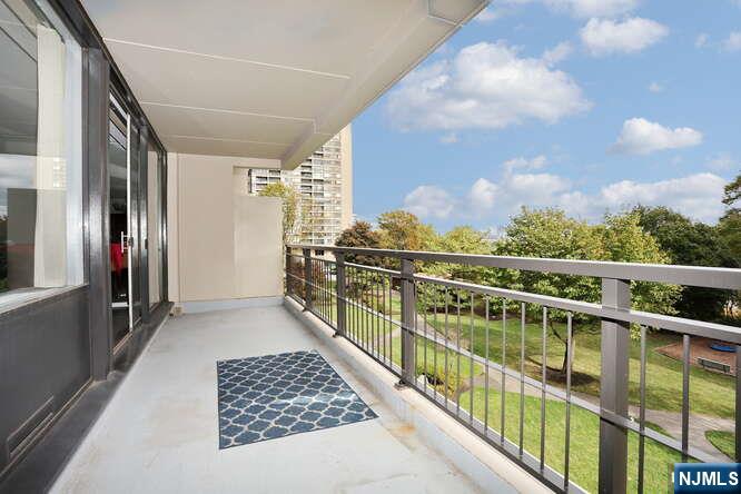 2 Horizon Road, Unit 404 Fort Lee, NJ 07024 - Photo 6 of 30 a view of balcony with wooden floor and fence