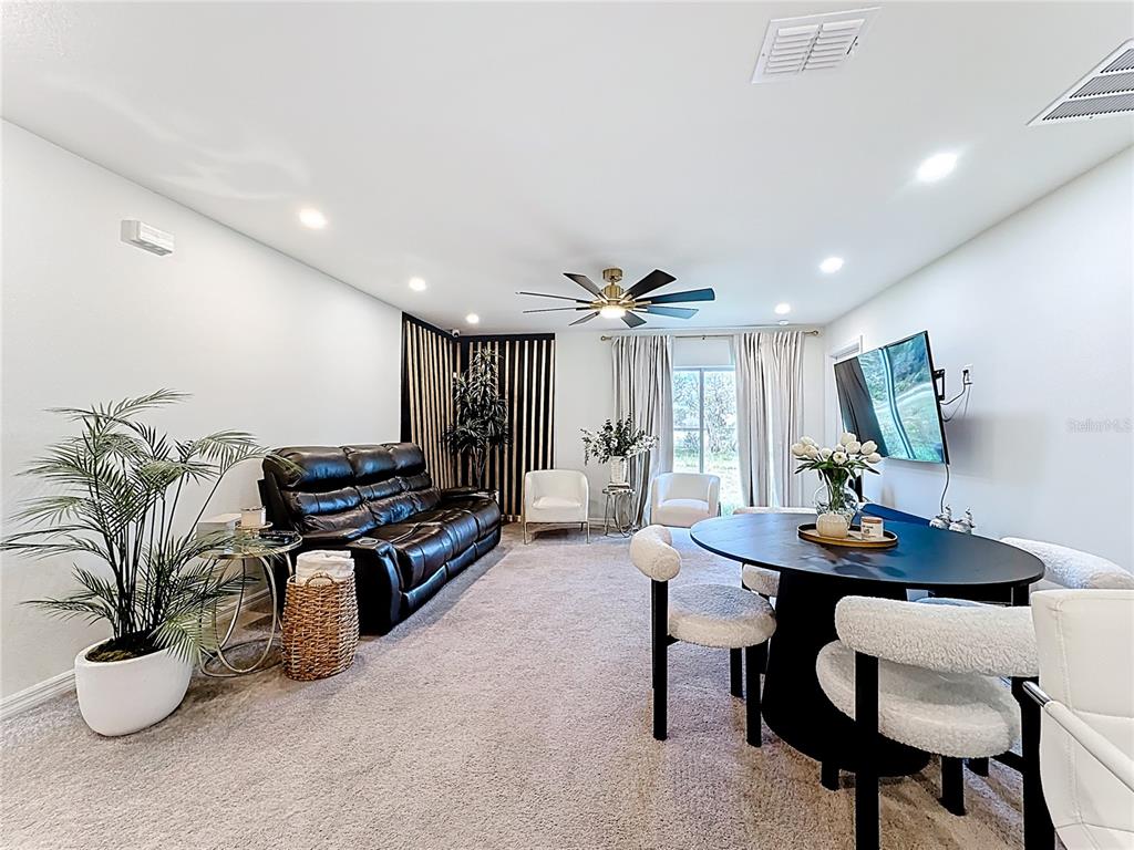 120 Bonito Way Kissimmee, FL 34759 - Photo 13 of 53 a living room with furniture and a table