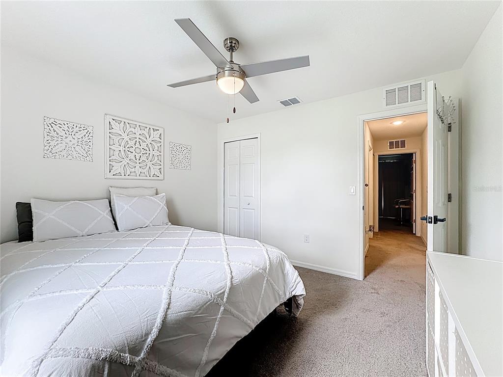120 Bonito Way Kissimmee, FL 34759 - Photo 18 of 53 a bedroom with a bed and a ceiling fan