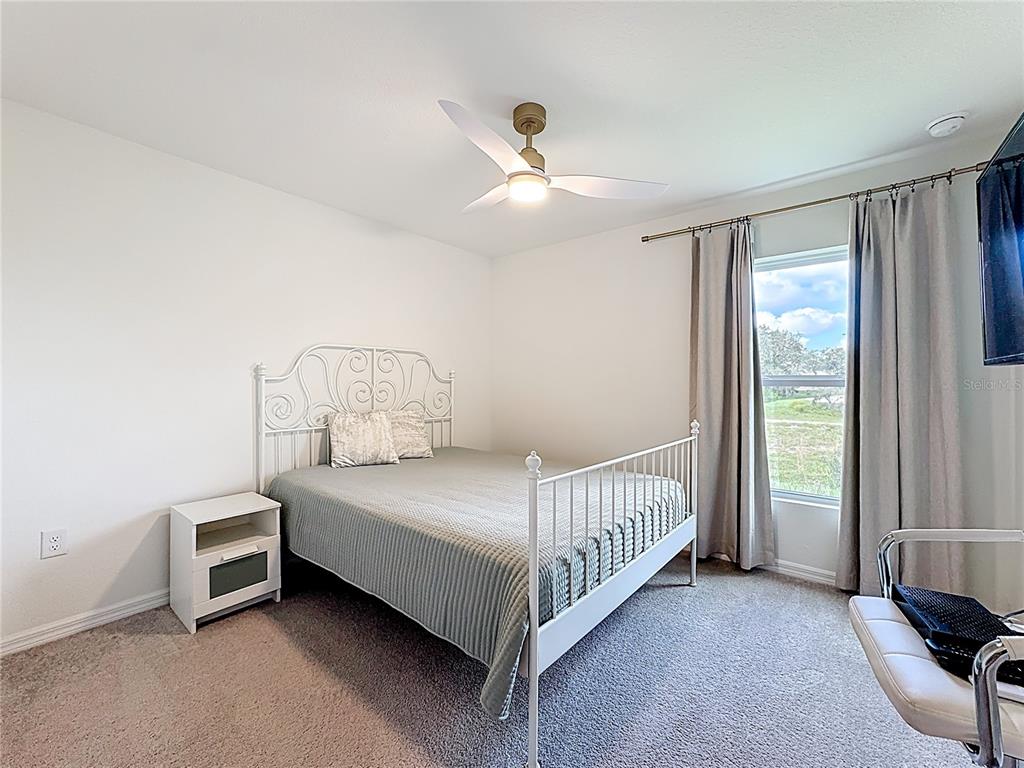 120 Bonito Way Kissimmee, FL 34759 - Photo 22 of 53 a bedroom with a bed and a window