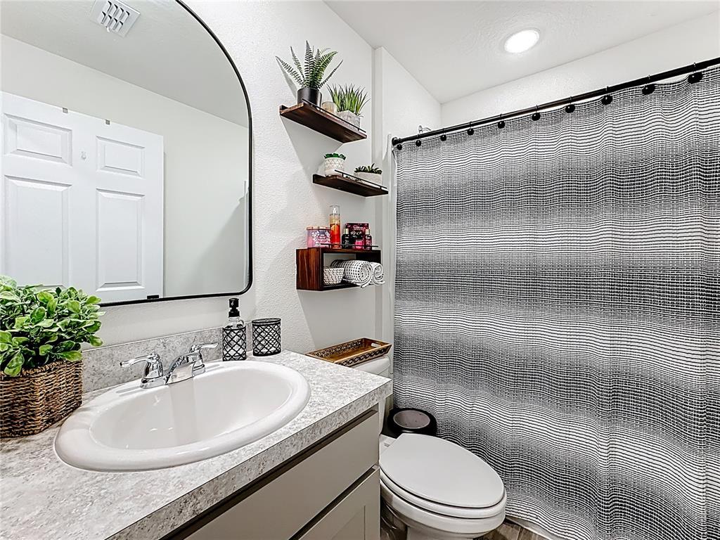 120 Bonito Way Kissimmee, FL 34759 - Photo 24 of 53 a bathroom with a sink toilet and shower